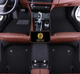 Ascot Jet custom car floor mats with black coil carpet set into black ribbed leather, fitted across the front and rear footwells