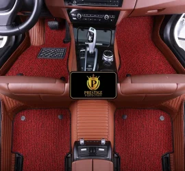 Ascot Ruby custom car floor mats with red and black coil carpet set into a tan ribbed leather base, fitted front and rear