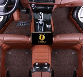 Ascot Walnut custom car floor mats with dark chocolate coil carpet set into a caramel ribbed leather base, fitted front and rear