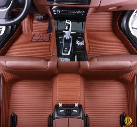 Portofino Caramel custom car floor mats in warm tan ribbed leather with tonal stitching, fitted front and rear in a car interior