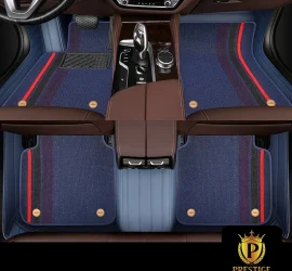 Riviera Monaco custom car floor mats in navy blue carpet with a red and black racing stripe, fitted across the front and rear footwells
