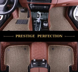 Sovereign Camel custom car floor mats in tan coil carpet with tan leather edging, fitted across the front and rear footwells of a car