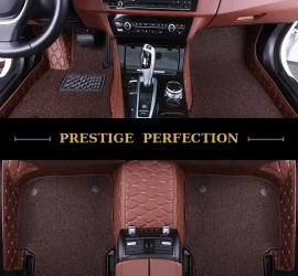 Sovereign Chestnut custom car floor mats in reddish-brown coil carpet with tan leather edging and cream stitching, fitted front and rear