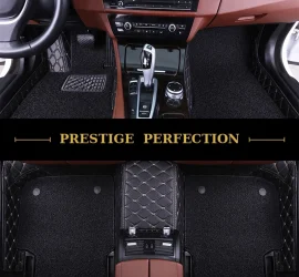 Sovereign Ebony custom car floor mats in black coil carpet with black leather edging and cream stitching, fitted front and rear