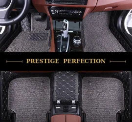 Sovereign Graphite custom car floor mats in dark grey coil carpet with black leather edging and cream stitching, fitted front and rear