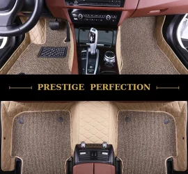 Sovereign Latte custom car floor mats in oatmeal coil carpet with cream leather edging, fitted across the front and rear footwells of a car