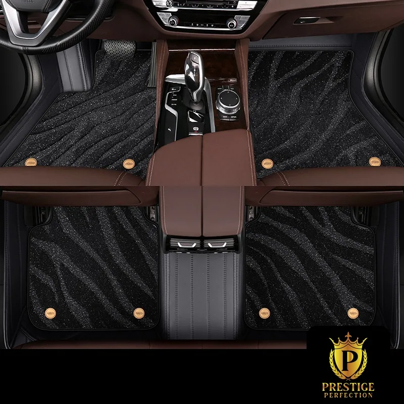 Onyx Black custom car floor mats in black shimmering wave-textured carpet with a black leather surround and gold badge studs
