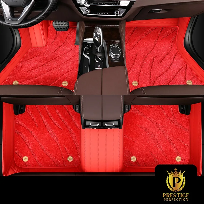 Onyx Red custom car floor mats in bright red wave-textured carpet with a matching red leather surround and gold badge studs