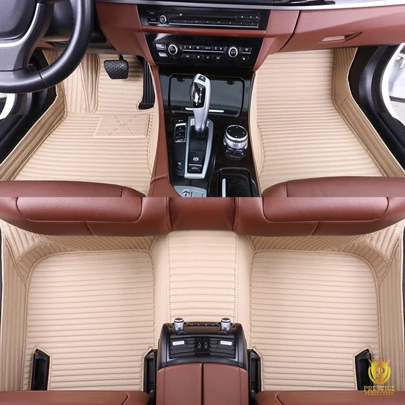 Portofino Beige custom car floor mats in cream ribbed leather with tonal stitching, fitted across the front and rear footwells of a car