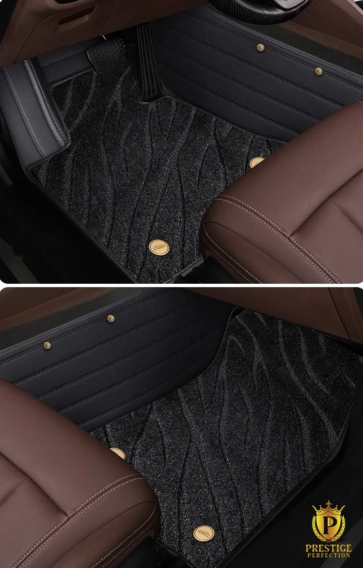 Riviera Series mats fitted in front and rear footwells, showing the flowing wave texture through the black coil carpet and a gold badge stud on each mat