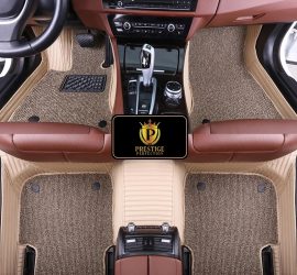 Ascot Ivory custom car floor mats with oatmeal coil carpet set into cream ribbed leather, fitted across the front and rear footwells