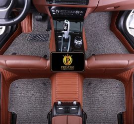 Ascot Pewter custom car floor mats with grey coil carpet set into a tan ribbed leather base, fitted across the front and rear footwells