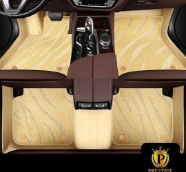 Onyx Beige custom car floor mats in champagne wave-textured carpet with a matching beige leather surround, fitted front and rear