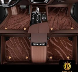 Onyx Brown custom car floor mats in chocolate wave-textured carpet with a matching brown leather surround, fitted front and rear