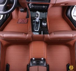 Portofino Caramel custom car floor mats in warm tan ribbed leather with tonal stitching, fitted front and rear in a car interior