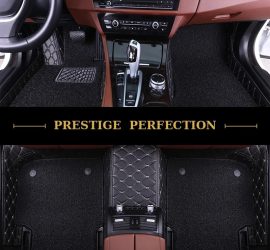 Sovereign Ebony custom car floor mats in black coil carpet with black leather edging and cream stitching, fitted front and rear