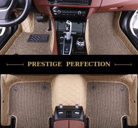 Sovereign Latte custom car floor mats in oatmeal coil carpet with cream leather edging, fitted across the front and rear footwells of a car
