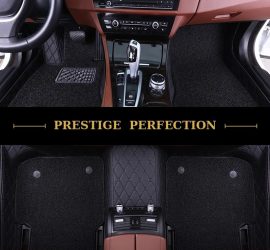 Sovereign Raven custom car floor mats in all-black coil carpet with black leather edging and black stitching, fitted front and rear
