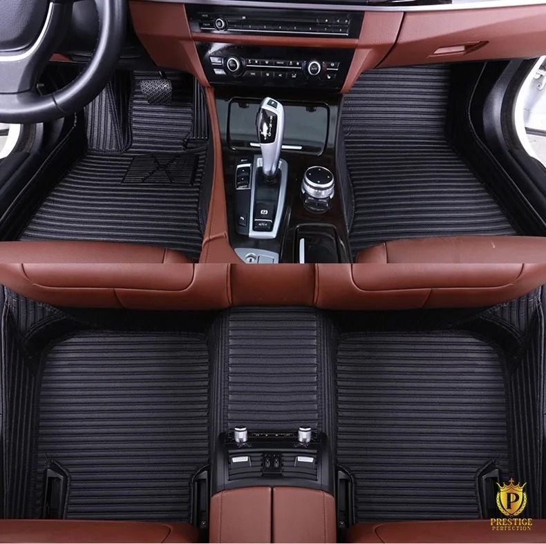 Portofino Black custom car floor mats in black ribbed leather with tonal stitching, fitted front and rear in a car with a tan interior