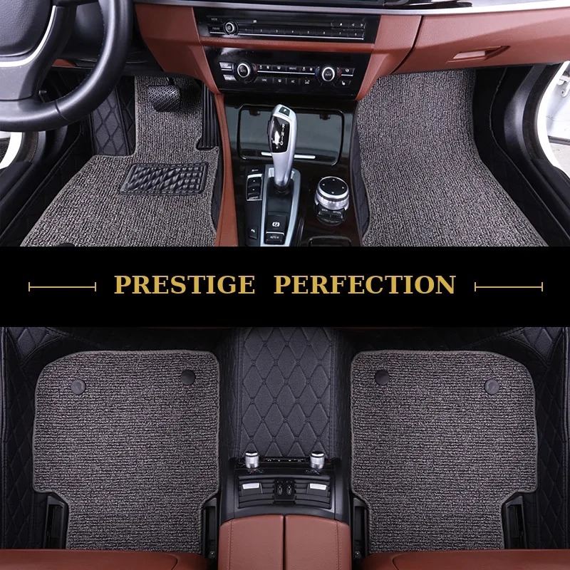 Sovereign Ash custom car floor mats in grey coil carpet with black leather edging, fitted across the front and rear footwells of a car