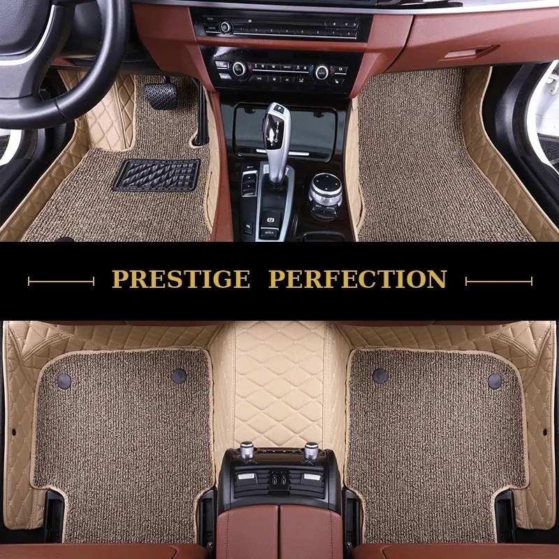 Sovereign Latte custom car floor mats in oatmeal coil carpet with cream leather edging, fitted across the front and rear footwells of a car